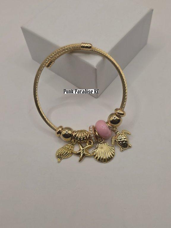 Golden pink shell charm bracelet